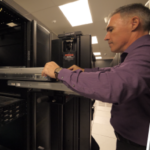 man safely installing data center equipment using ServerLIFT